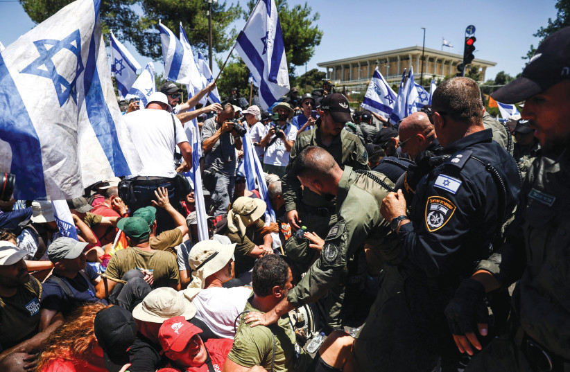  PROTESTING JUDICIAL reform outside the Knesset last week.  (photo credit: RONEN ZVULUN/REUTERS)