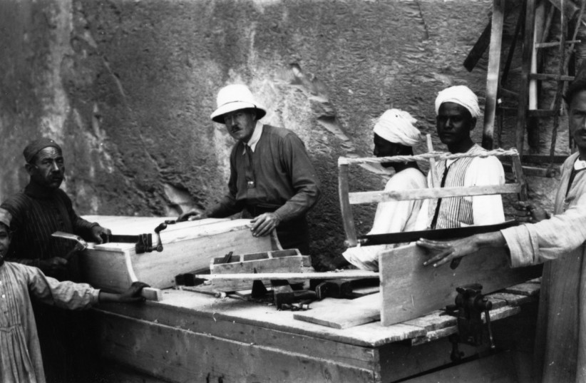 BRITISH ARCHAEOLOGIST Howard Carter supervises carpenters preparing to reseal Tutankhamun’s tomb, in Luxor, Egypt.  (photo credit: Hulton Archive/Getty Images)
