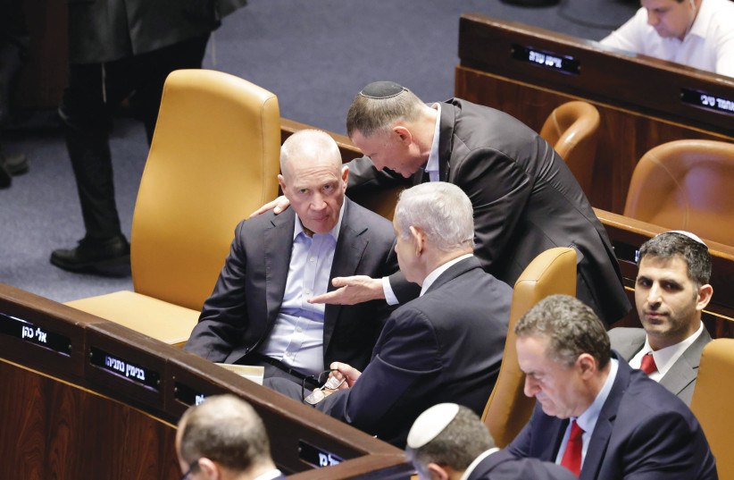  YULI EDELSTEIN talks to Defense Minister Yoav Gallant as Prime Minister Benjamin Netanyahu looks on during the Knesset vote on the reasonableness standard last week.  (photo credit: MARC ISRAEL SELLEM/THE JERUSALEM POST)