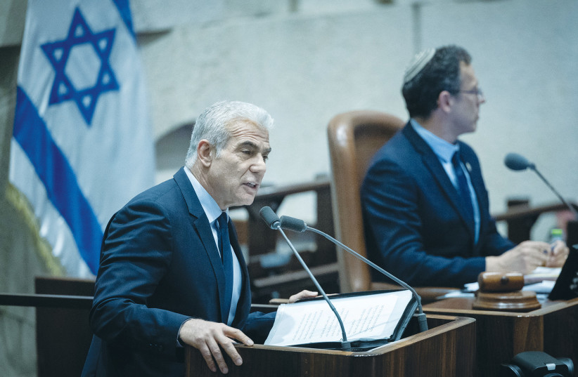  OPPOSITION LEADER Yair Lapid addresses the Knesset plenum, last week. The opposition should signal now that it is not out for total victory over the coalition, says the writer. (photo credit: YONATAN SINDEL/FLASH90)