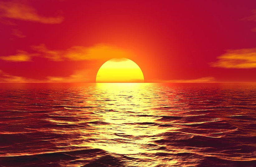  A bright yellow sun against a dark reddish orange sky sets over ocean waves. (photo credit: PXFUEL)