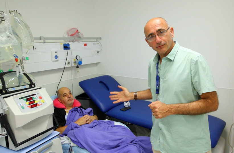  Prof. Adi Leiba with equipment and patient. (photo credit: Assuta-Ashdod University Hospital)