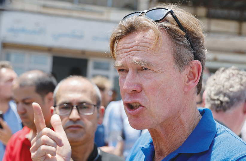 SVEN KUHN von Burgsdorff, the representative ambassador of the European Union in Palestine, speaks to the media at Jenin refugee camp, last month. (photo credit: RANEEN SAWAFTA/REUTERS)