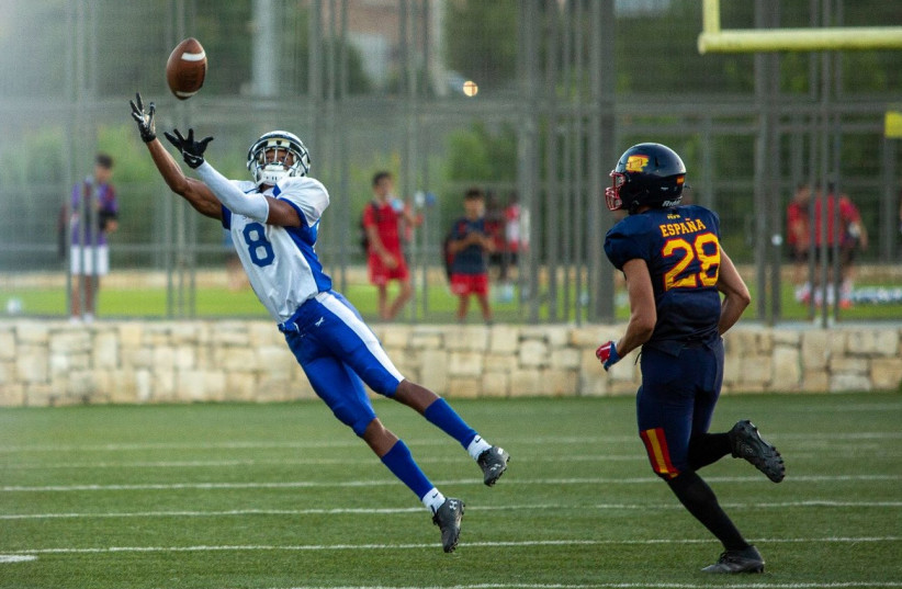 ISRAEL RECEIVER Nabiel Ben Shalom (left) dives for a ball during the blue-and-white’s 30-23 victory over Spain. (photo credit: RACHEL WOLF)