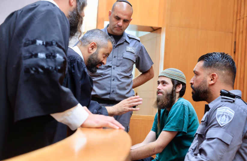  Israeli settler activist Elisha Yered, suspected of involvement in the death of a Palestinian teenager near Burka, is seen in a courthouse in Jerusalem, on August 9, 2023. (photo credit: MARC ISRAEL SELLEM/THE JERUSALEM POST)