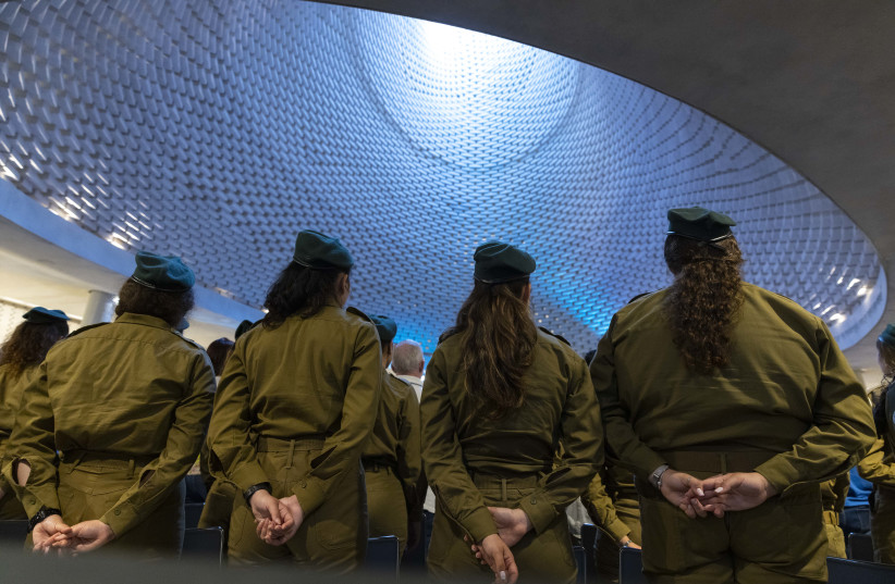  Israeli female soldiers at a ceremony in memory of the Israeli soldiers who were killed in the First Lebanon War- Operation Peace for Galilee, at the National Hall of Remembrance at Mount Herzl in Jerusalem on June 14, 2022. (photo credit: OLIVIER FITOUSSI/FLASH90)