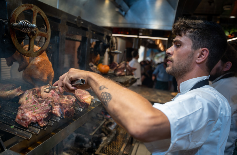 FLAME’S KITCHEN prepares flavorful cuts of meat over the traditional Parilla.  (photo credit: Yuri Skvirski)