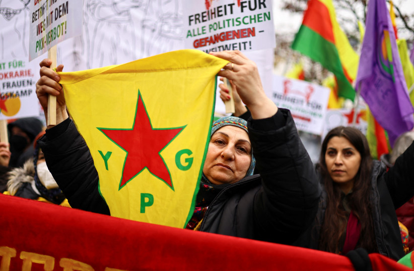  Pro-Kurd protesters hold flags with portraits of jailed Kurdistan Workers Party (PKK) leader Abdullah Ocalan as they take part in a demonstration in support to him (photo credit: REUTERS)