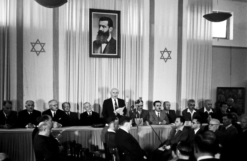  David Ben-Gurion publicly pronouncing the Declaration of the State of Israel, May 14, 1948, beneath a large portrait of Theodor Herzl, founder of modern political Zionism, in the old Tel Aviv Museum of Art building on Rothschild Street.  (photo credit: RUDI WEISSENSTEIN/GPO)