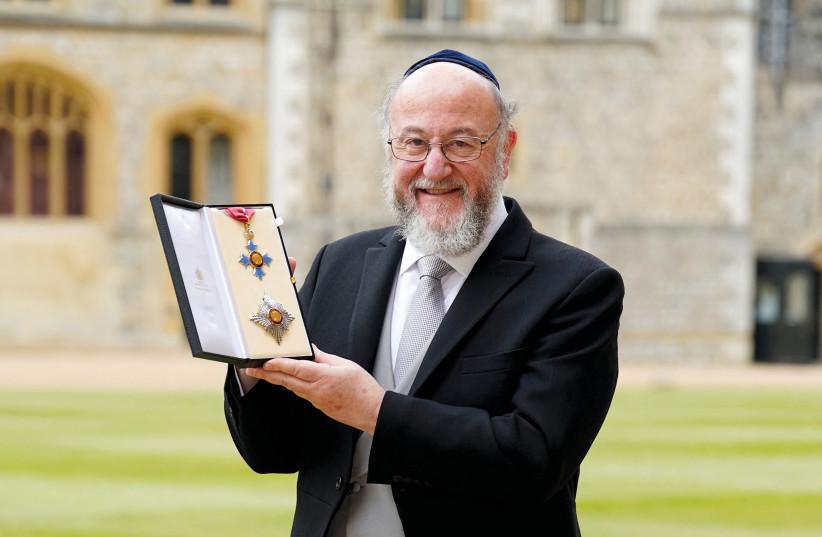  Chief Rabbi Sir Ephraim Mirvis after receiving his knighthood for services to the Jewish community, interfaith relations and education during an investiture ceremony at Windsor Castle on July 11.  (photo credit: Andrew Matthews/Pool/Reuters)