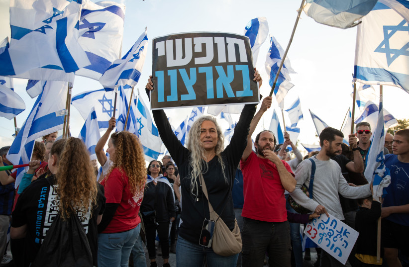  Protesters rally against the government’s judicial overhaul bills at Karkur Junction, in March 2023. More than 200,000 Israelis attended protests all over the country. (photo credit: SHIR TOREM/FLASH90)