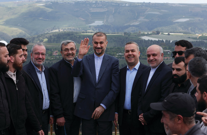  IRANIAN FOREIGN Minister Hossein Amirabdollahian gestures as he stands next to Hezbollah officials during his visit in April to Maroun Al-Ras, a Lebanese village near the border with Israel. (photo credit: AZIZ TAHER/REUTERS)