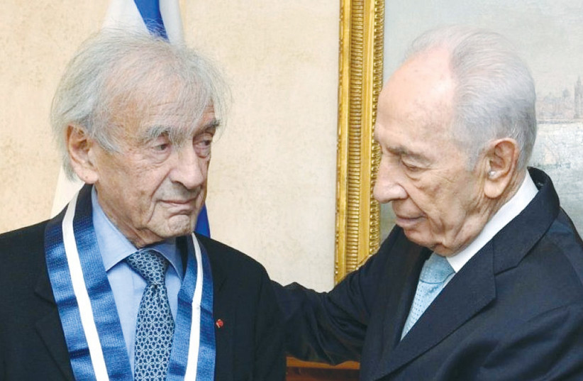  FORMER PRESIDENT Shimon Peres presents Elie Wiesel with the Medal of Distinction.  (photo credit: MARK NEYMAN/GPO)