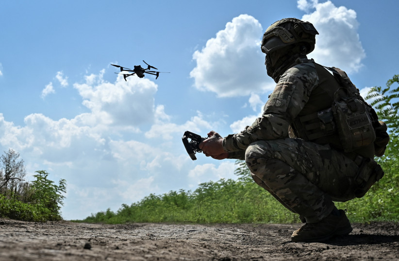   Ukrainian serviceman of 108th separate territorial defence brigade of the Armed Forces of Ukraine launches a drone near a frontline,August 4, 2023 (photo credit: REUTERS/STRINGER)