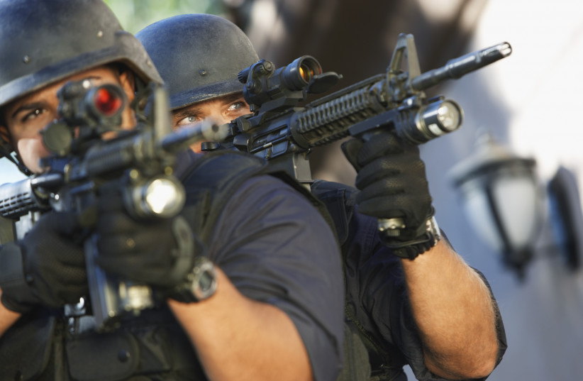  SWAT officers aiming guns (illustrative). (photo credit: INGIMAGE)