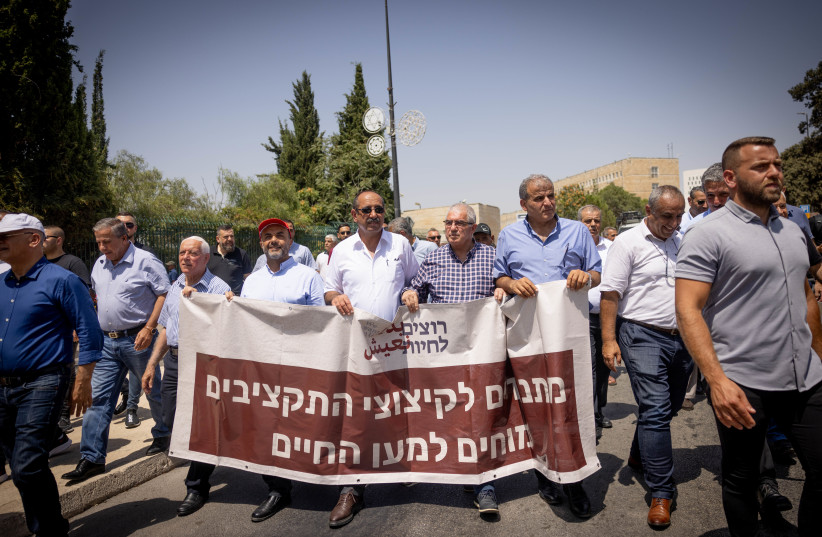  Arab citizens protest the budget cut in the Arab sector, outside the Finance Ministry in Jerusalem, on August 13, 2023.  (photo credit: Chaim Goldberg/Flash90)