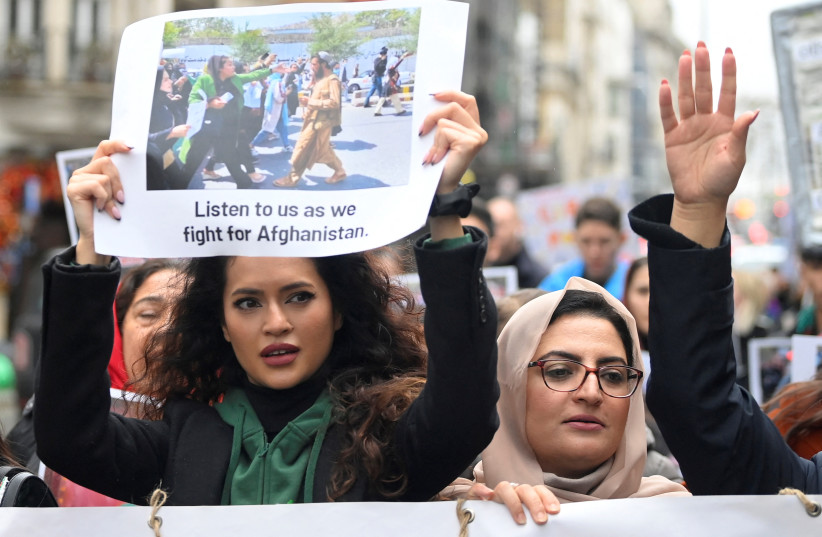  Protesters take part in a march and rally in support of Afghan women's rights in London, Britain, November 27, 2022.  (photo credit: REUTERS/TOBY MELVILLE)