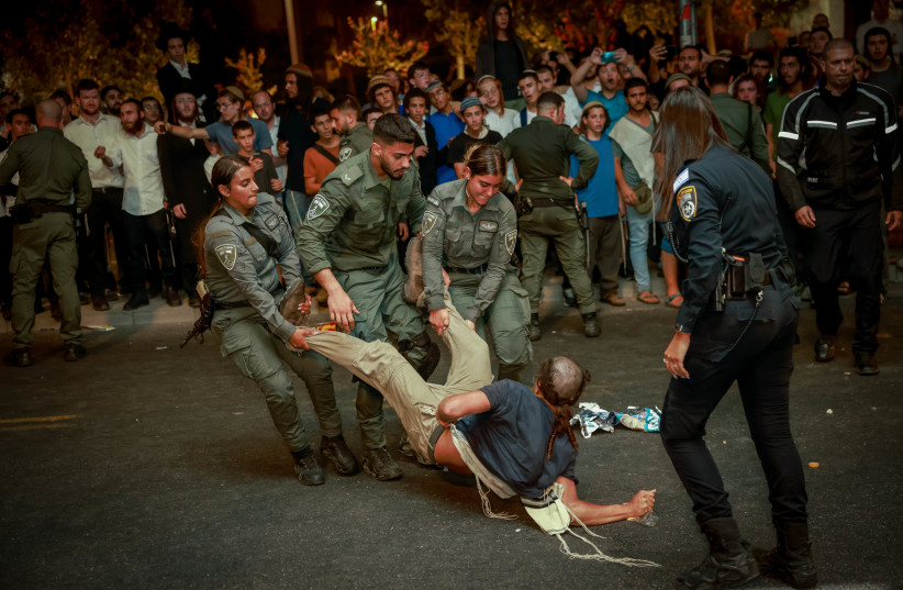  Police clash with Israelis during a protest calling for the release of Yehiel Indore at the entrance to Jerusalem on August 13, 2023 (photo credit: Chaim Goldberg/Flash90)