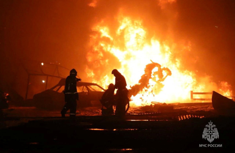  Firefighters work at the accident scene following an explosion at a gas station in the city of Makhachkala, Russia, in this handout picture published August 15, 2023.  (photo credit: Russian Emergencies Ministry/Handout via REUTERS)