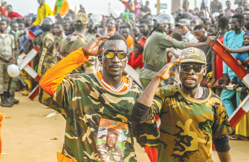  NIGER’S JUNTA supporters demonstrate in front of a French army base in Niamey, Niger, last week. (photo credit: Mahamadou Hamidou/Reuters)