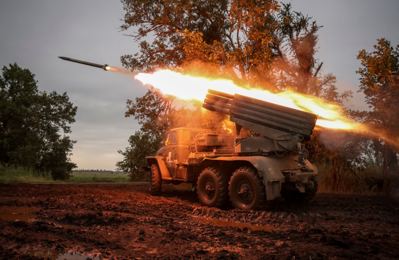  Ukrainian servicemen fire a BM-21 Grad multiple launch rocket system towards Russian troops near a front line, amid Russia's attack on Ukraine, in Donetsk region, Ukraine August 11, 2023. (photo credit: REUTERS/OLEKSANDR RATUSHNIAK)