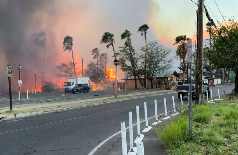  Smoke and flames rise in Lahaina, Maui County, Hawaii, U.S., August 8, 2023 in this still image from video obtained from social media. (photo credit: Jeff Melichar/TMX/via REUTERS)