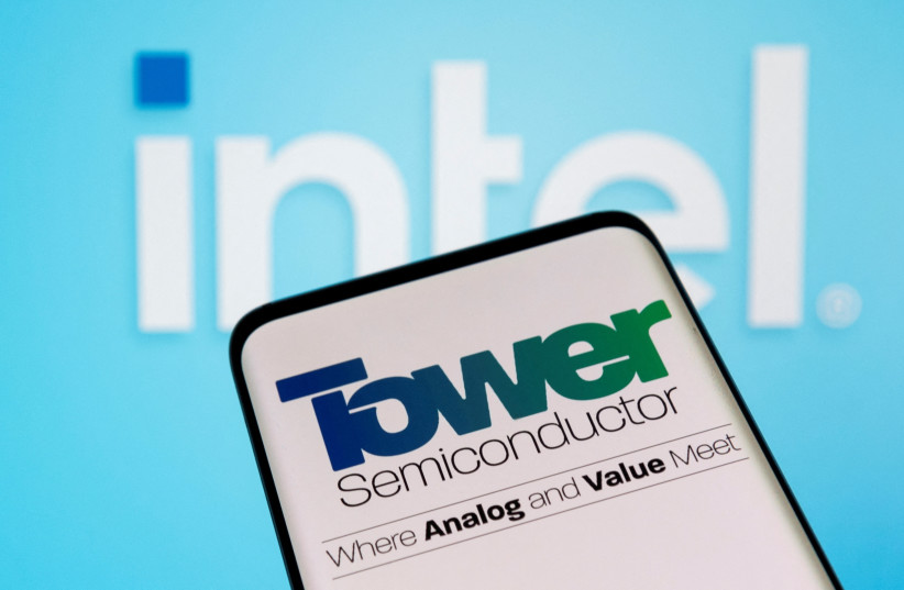  Tower Semiconductor is seen on smartphone in front of displayed Intel logo in this illustration taken, February 15, 2022. (photo credit: REUTERS/DADO RUVIC/ILLUSTRATION/FILE PHOTO)