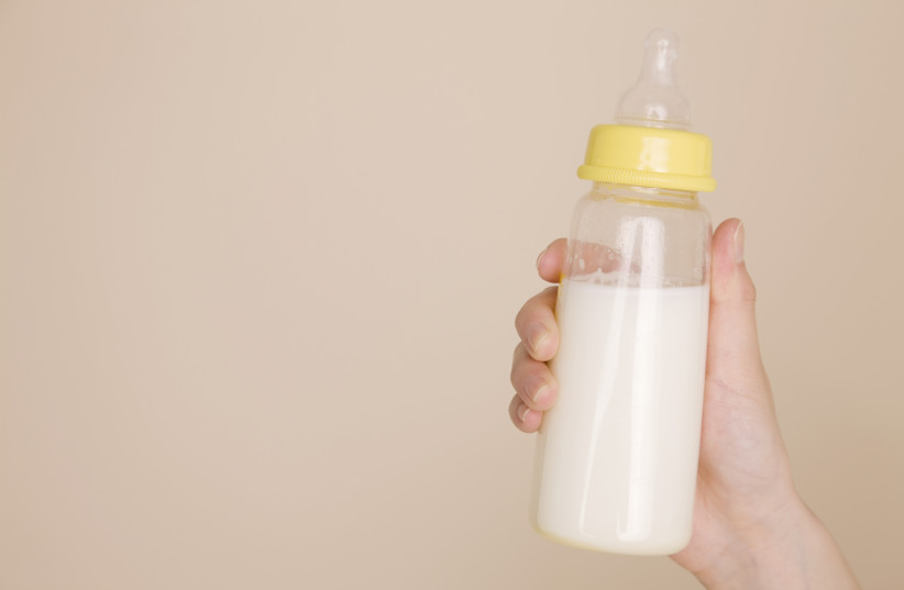  Baby bottle with milk inside. (photo credit: INGIMAGE)
