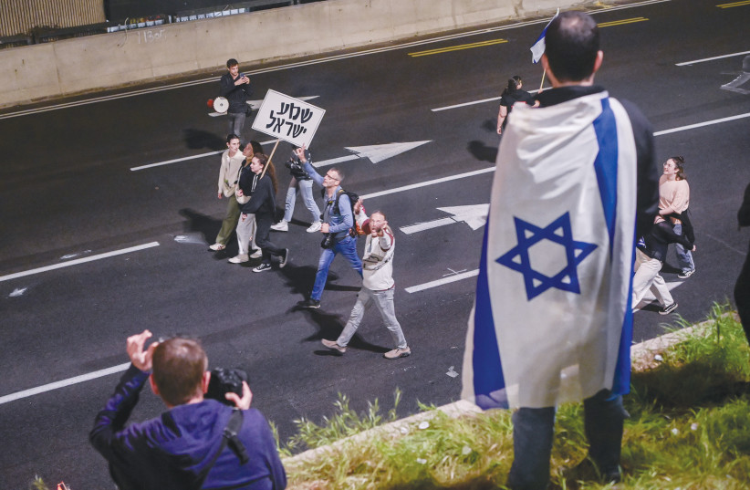  DIRECTLY AFTER the pandemic, Israelis returned to the street even more strongly, all the way down to the blocked Ayalon highway, says the writer. (photo credit: AVSHALOM SASSONI/FLASH90)
