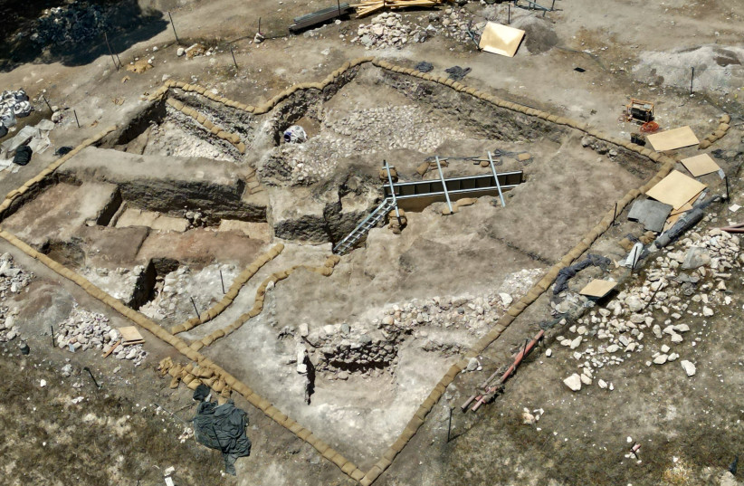  Aerial view showing stone-covered plaza scheduled for future excavation to access the passageway with the corbelled vault, Tel Shimron. (photo credit: EYECON)