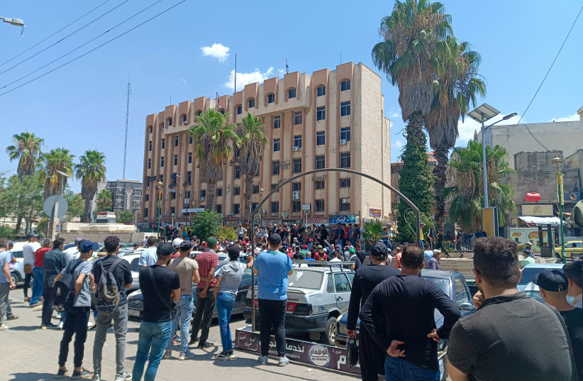 Demonstrators protest against the Syrian government decision on increasing the prices of fuels in Sweida, Syria, August 17,2023 (photo credit: Sweida 24/Handout via REUTERS)