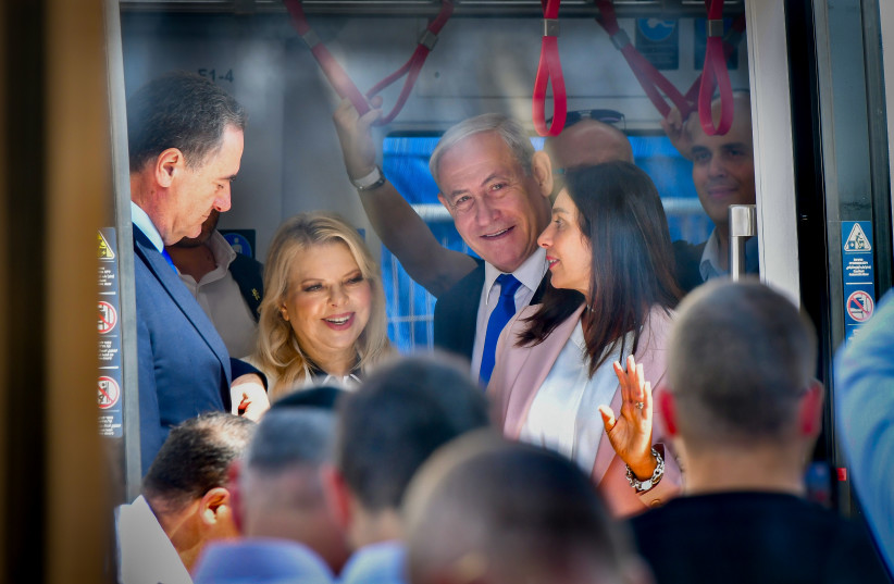  Prime Minister Benjamin Netanyahu, his wife Sara and Ministers at the opening ceremony of the light rail, in Petah Tikva, August 17, 2023 (photo credit: AVSHALOM SASSONI/FLASH90)