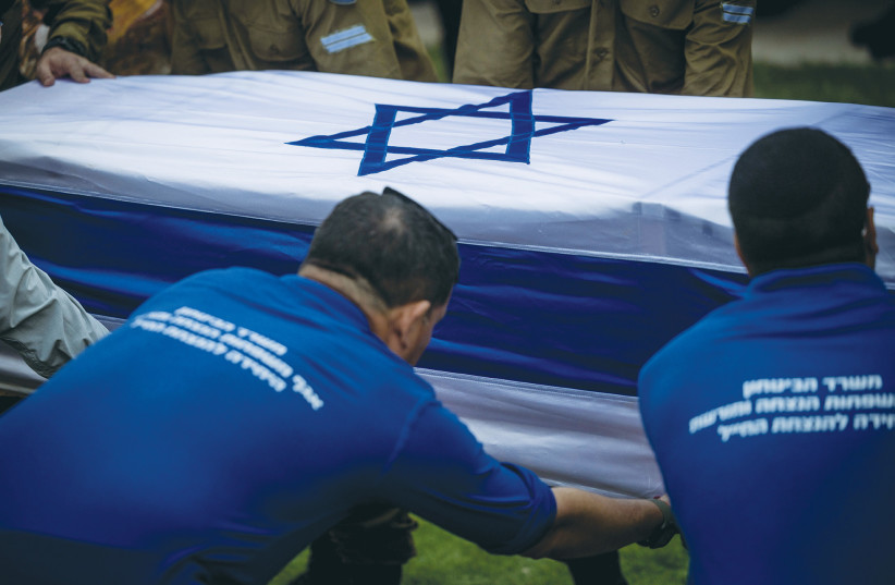 IDF SOLDIER Hillel Ofen is laid to rest at Mt. Herzl Military Cemetery in Jerusalem on Tuesday. (photo credit: Chaim Goldberg/Flash90)