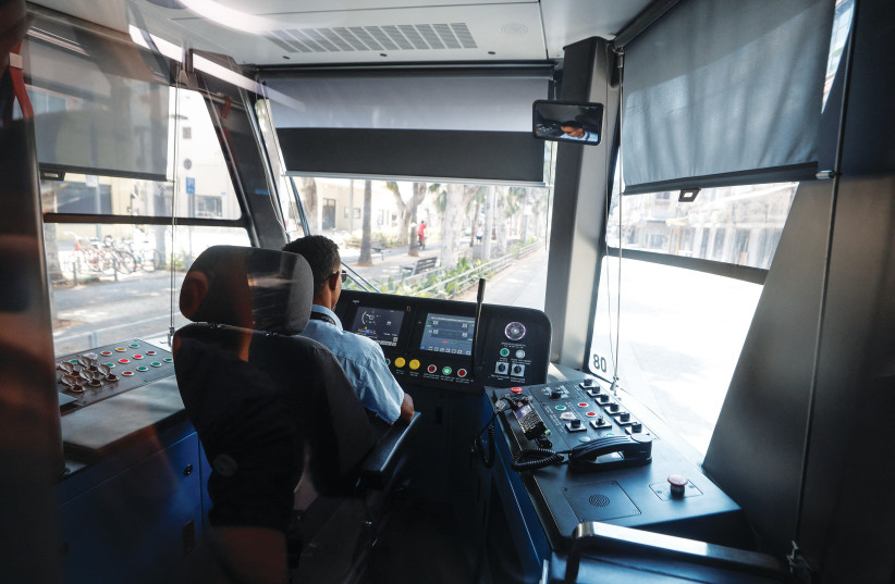  A DRIVER conducts a test run this week for the Tel Aviv Light Rail line that was to be launched on Friday. (photo credit: AMIR COHEN/REUTERS)