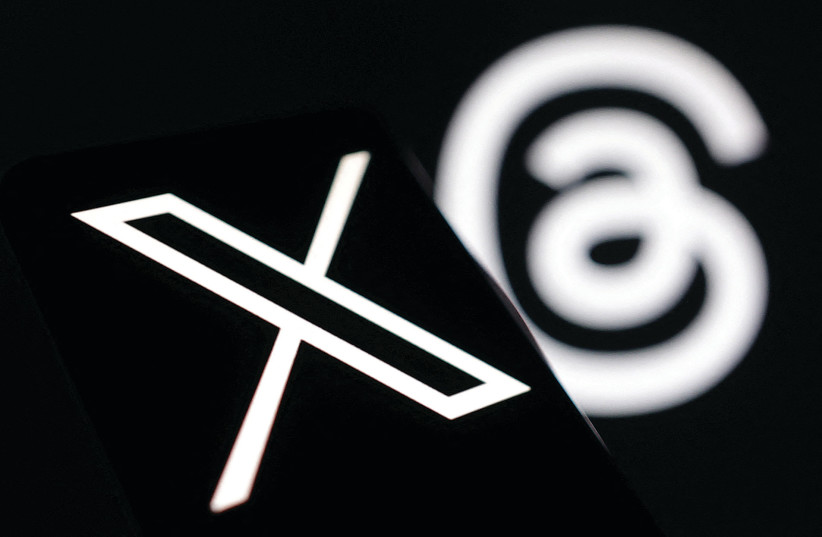 AN ILLUSTRATION of the new logo of X (Twitter) is seen with the logo of Meta’s Threads. (photo credit: DADO RUVIC/REUTERS)