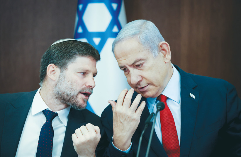  PRIME MINISTER Benjamin Netanyahu and Finance Minister Bezalel Smotrich confer at a cabinet meeting. (photo credit: Amit Shabi/Flash 90)