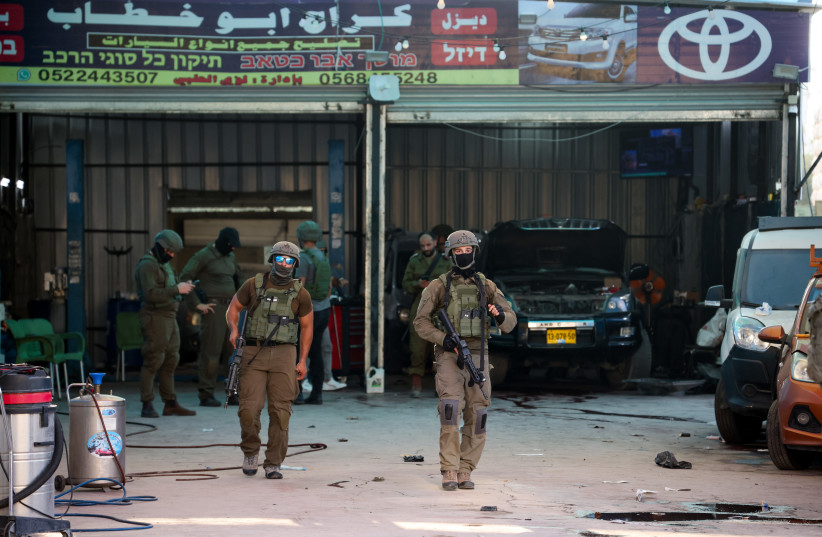  Israeli security forces secure the scene of a shooting attack in Huwara, in the West Bank, near Nablus, August 19, 2023 (photo credit: FLASH90)