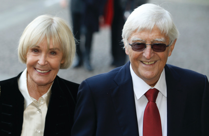  MICHAEL PARKINSON and his wife Mary arrive at a memorial service for former broadcaster David Frost in London, in 2014.  (photo credit: Luke MacGregor/Reuters)