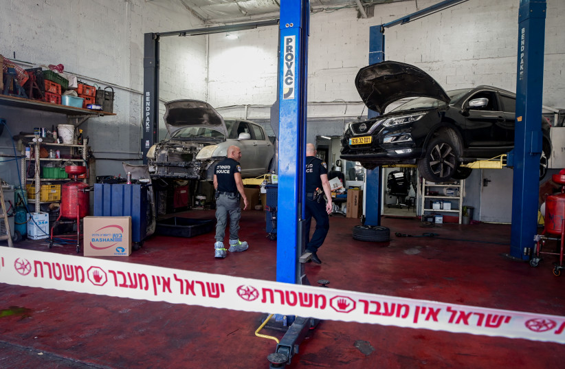  Police at the scene where a worker at a garage stabbed by a Jordanian worker in a suspect terror stabbing attack, in Petah Tikva, August 10, 2023 (photo credit: AVSHALOM SASSONI/FLASH90)
