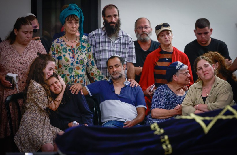  Family and friends attend the funeral of Batsheva Nigri who was murdered in a terrorist shooting attack near Hebron earlier today at the Gush Etzion Regional Cemetery in Kfar Etzion on August 21, 2023 (photo credit: Chaim Goldberg/Flash90)
