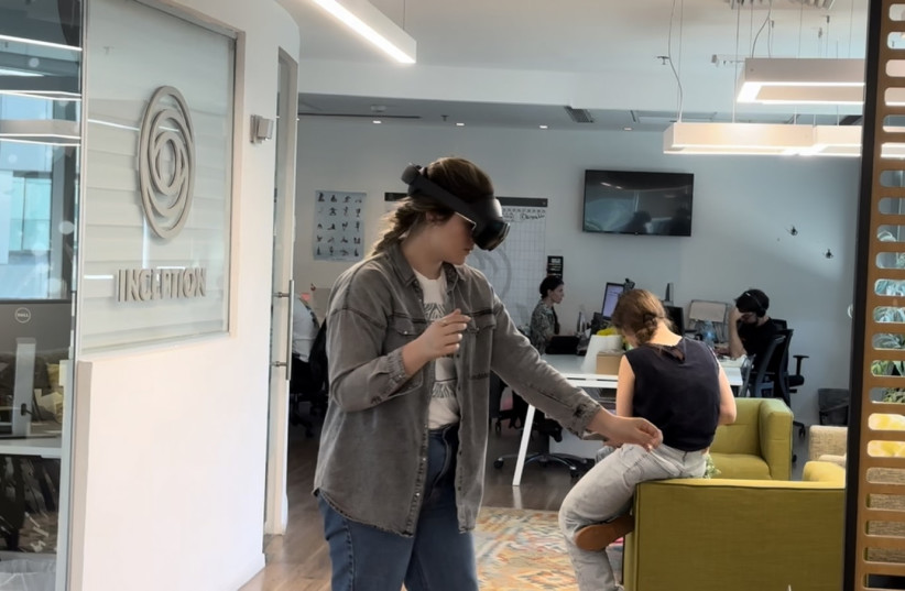  A developer tests changes she made to the VR simulation in the InceptionXR office in Tel Aviv, July 12, 2023. (photo credit: Patrick Doyle/The Media Line)