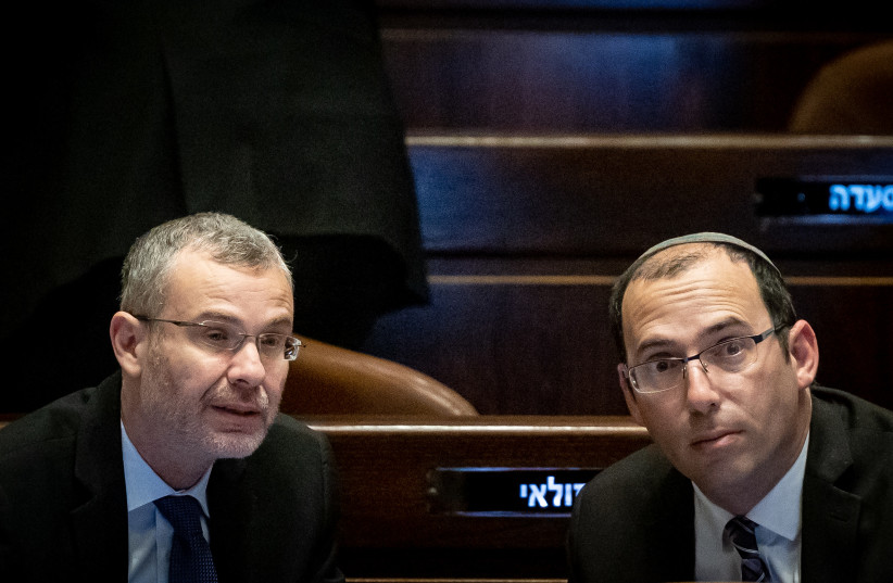  MK Simcha Rothman with Justice Minister Yariv Levin seen during a discussion and a vote in the assembly hall of the Knesset, the Israeli parliament in Jerusalem, on March 22, 2023. (photo credit: YONATAN SINDEL/FLASH90)