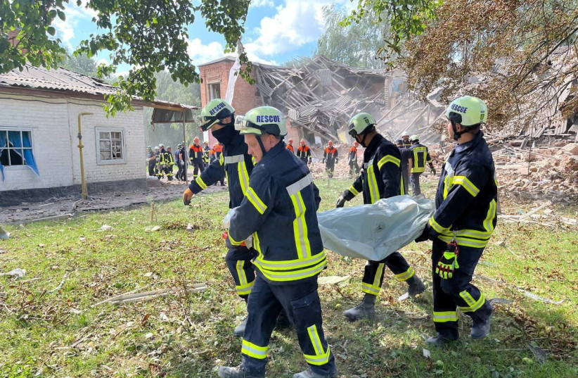  Rescuers work at the site of a Russian drone strike, amid Russia's attack on Ukraine, in Romny in Sumy region, Ukraine August 23, 2023.  (photo credit: National Police/Handout via REUTERS)