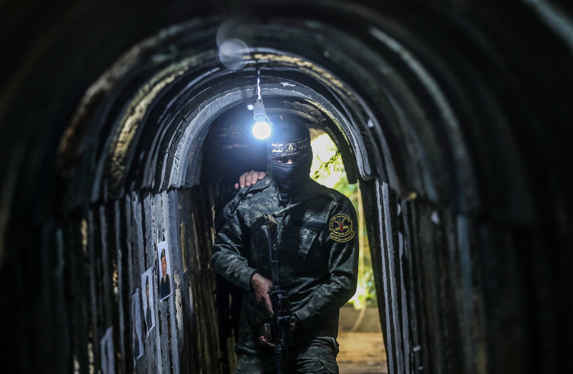  A Palestinian fighter of the Al-Quds brigades, the military wing of Palestinian Islamic Jihad (PIJ), seen inside a military tunnel in Beit Hanun, in the Gaza Strip. May 18, 2022. (photo credit: ATTIA MUHAMMED/FLASH90)