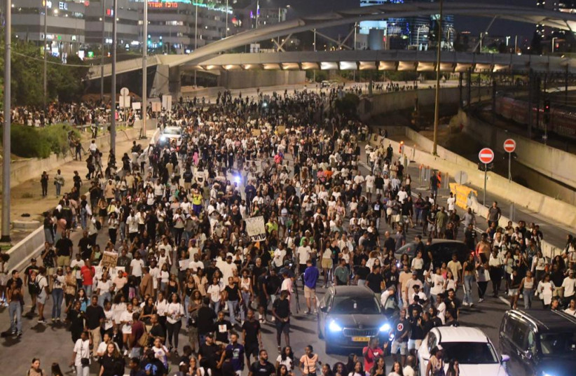   Protesters block the Ayalon highway in protest against the treatment of the hit-and-run case in which Rafael Adana, 4, was killed. August 23, 2023 (photo credit: AVSHALOM SASSONI)