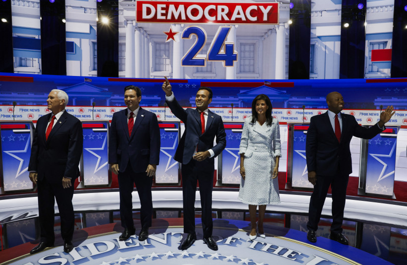 Former U.S. Vice President Mike Pence, Florida Governor Ron DeSantis, businessman Vivek Ramaswamy, former South Carolina Governor Nikki Haley and U.S. Senator Tim Scott (R-SC) pose together before the start before the start of the first Republican candidates' debate of the 2024 U.S. presidential cam (photo credit: JONATHAN ERNST/REUTERS)