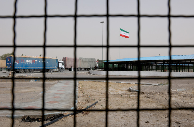  Iran's flag is pictured at the Milak border crossing between Iran and Afghanistan, Sistan and Baluchestan Province, Iran September 8, 2021 (photo credit: MAJID ASGARIPOUR/WANA (WEST ASIA NEWS AGENCY) VIA REUTERS)
