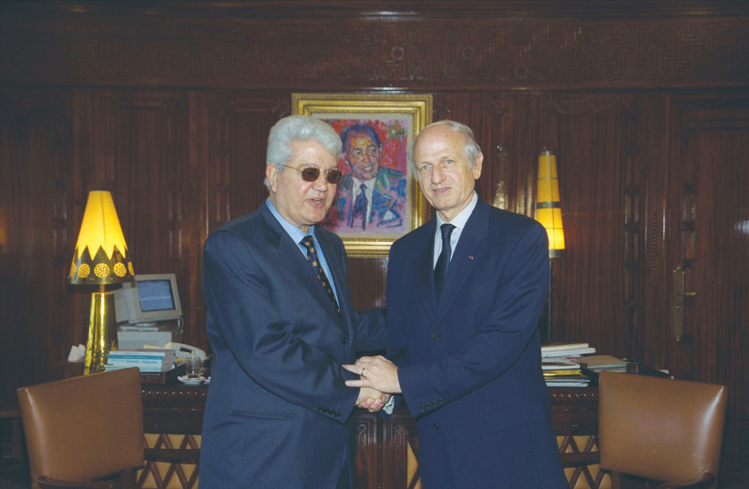  THEN-FOREIGN MINISTER David Levy (left) meets with André Azoulay, the adviser of the Moroccan king, in 2000. (photo credit: Moshe Milner/GPO)