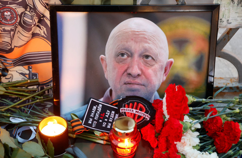  A view shows a portrait of Wagner mercenary chief Yevgeny Prigozhin at a makeshift memorial in Moscow, Russia August 24, 2023. (photo credit: REUTERS/STRINGER)