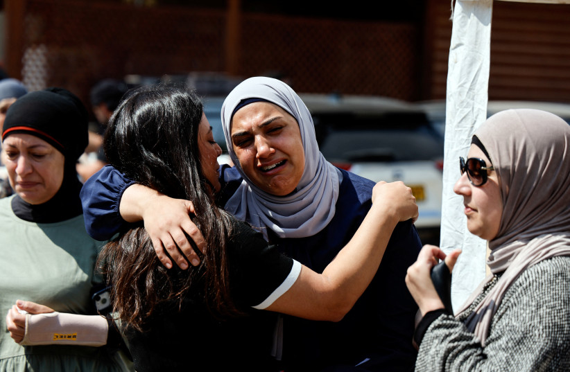  Relatives and friends take part in the funeral of Abdelrahman Kashua, director general of the Arab city of Tira in Israel, who was fatally shot as criminal violence surges in Arab communities, in Tira, Israel, August 23, 2023. (photo credit: REUTERS/AMMAR AWAD)